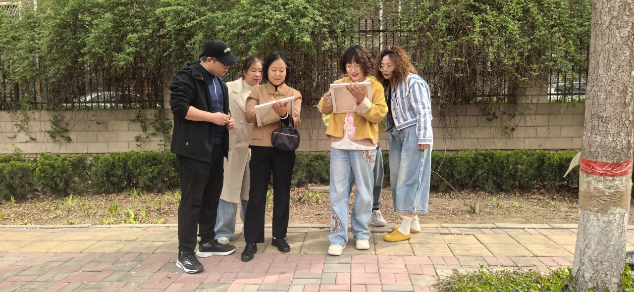 市文化馆手机短视频拍摄团队,走进“樱花大道”实地采风创作